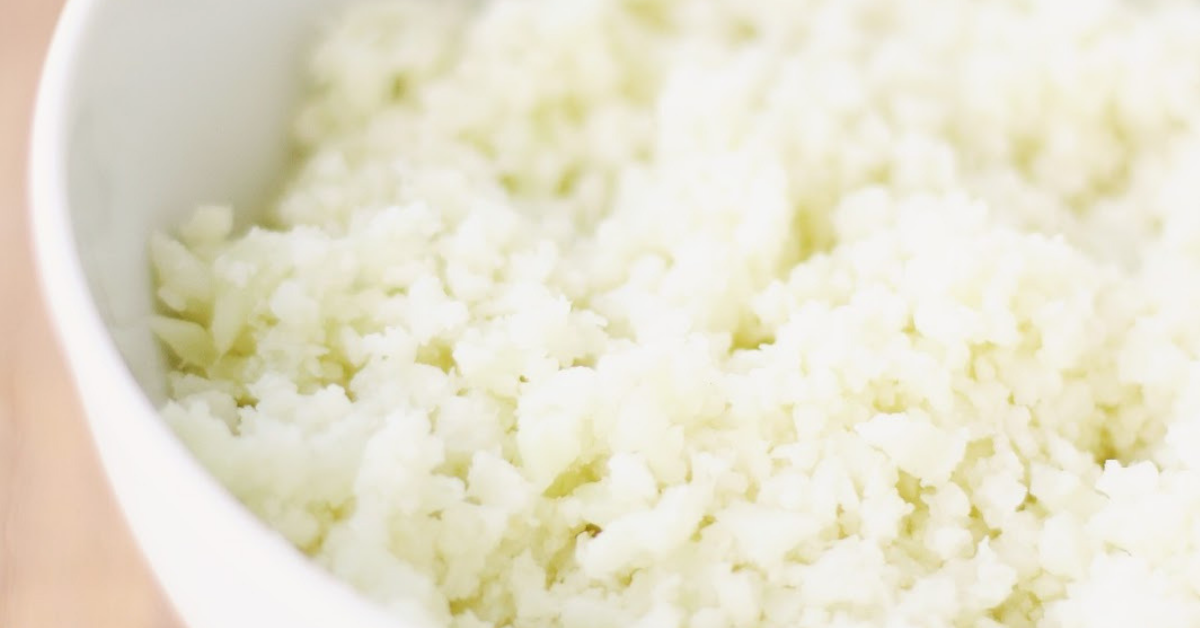 Riced cauliflower in a white bowl